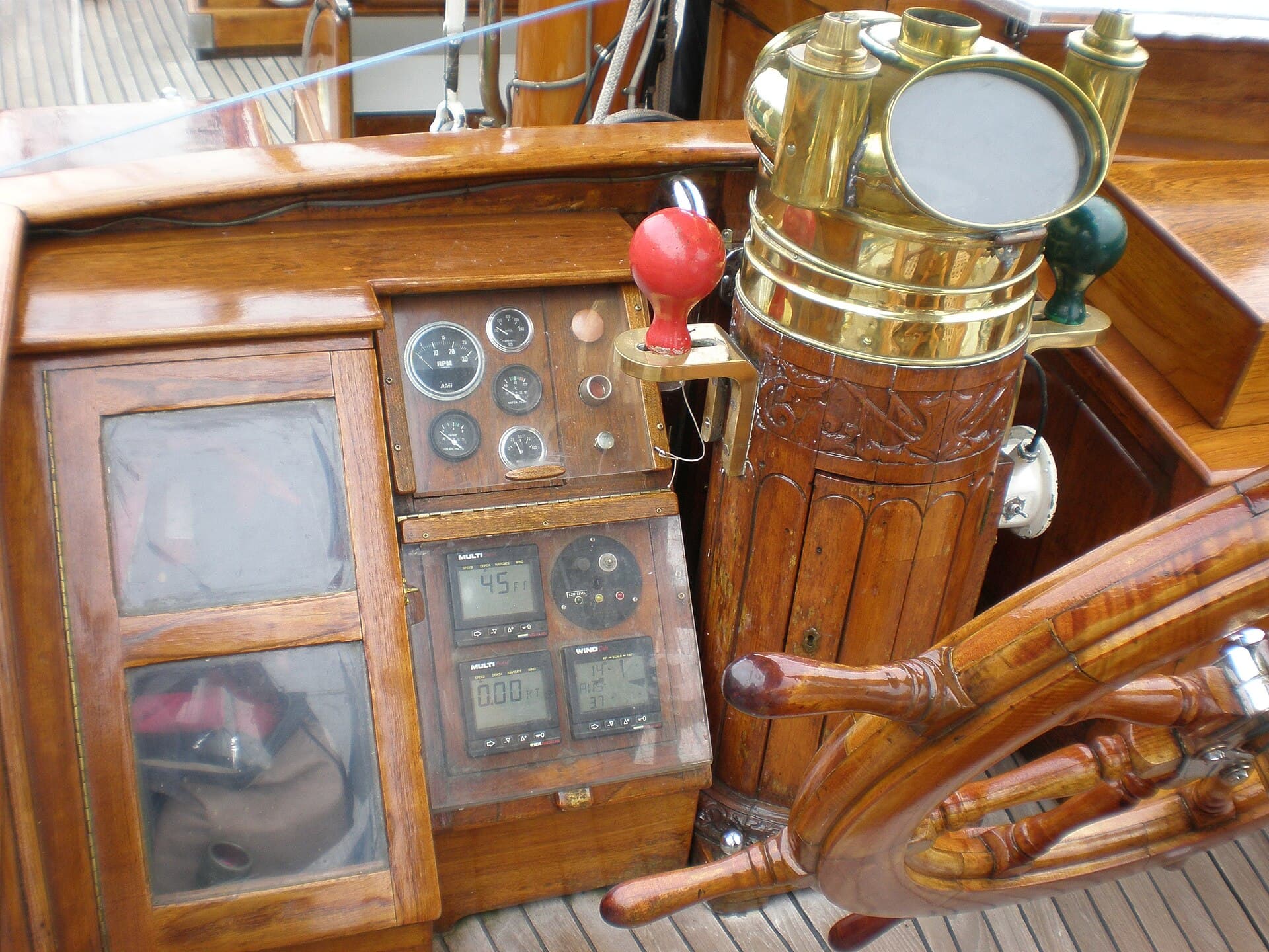 Compass and instrument readouts at a sailing helm